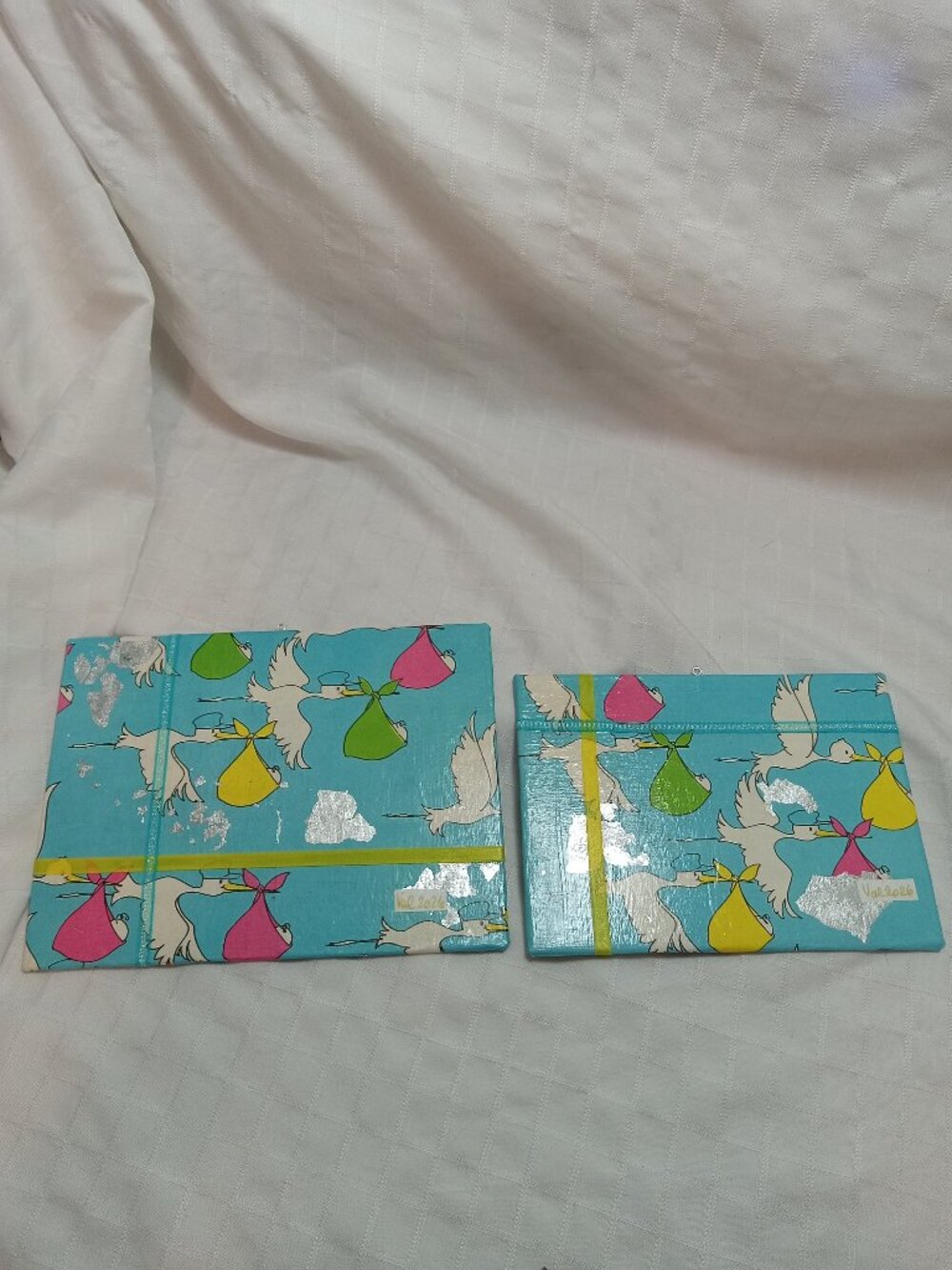 A set of handmade canvas for a baby's room, made of thin vintage wrapping paper